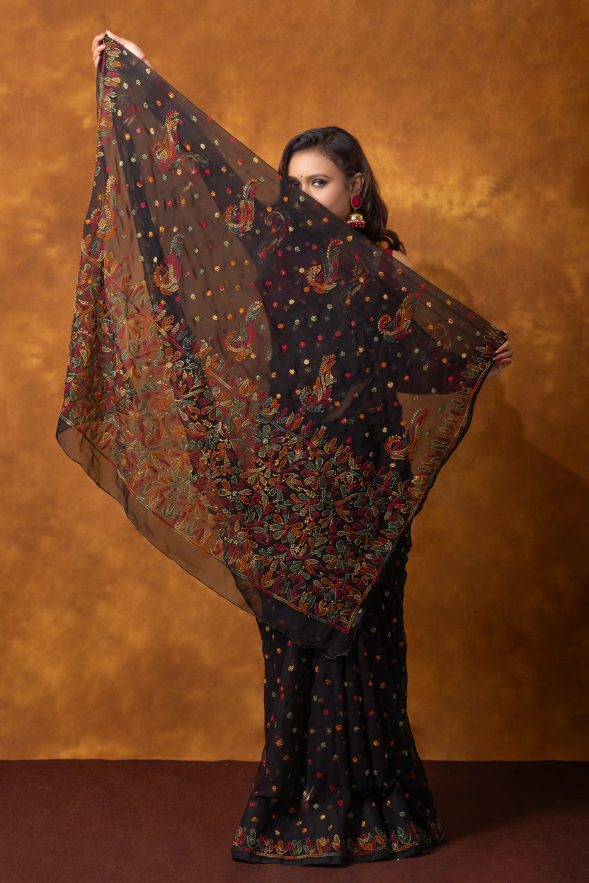 Woman holding a large patterned scarf against a brown background