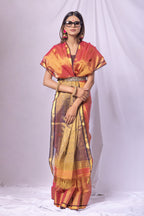 Woman wearing a traditional outfit with a colorful saree and blouse on a white background