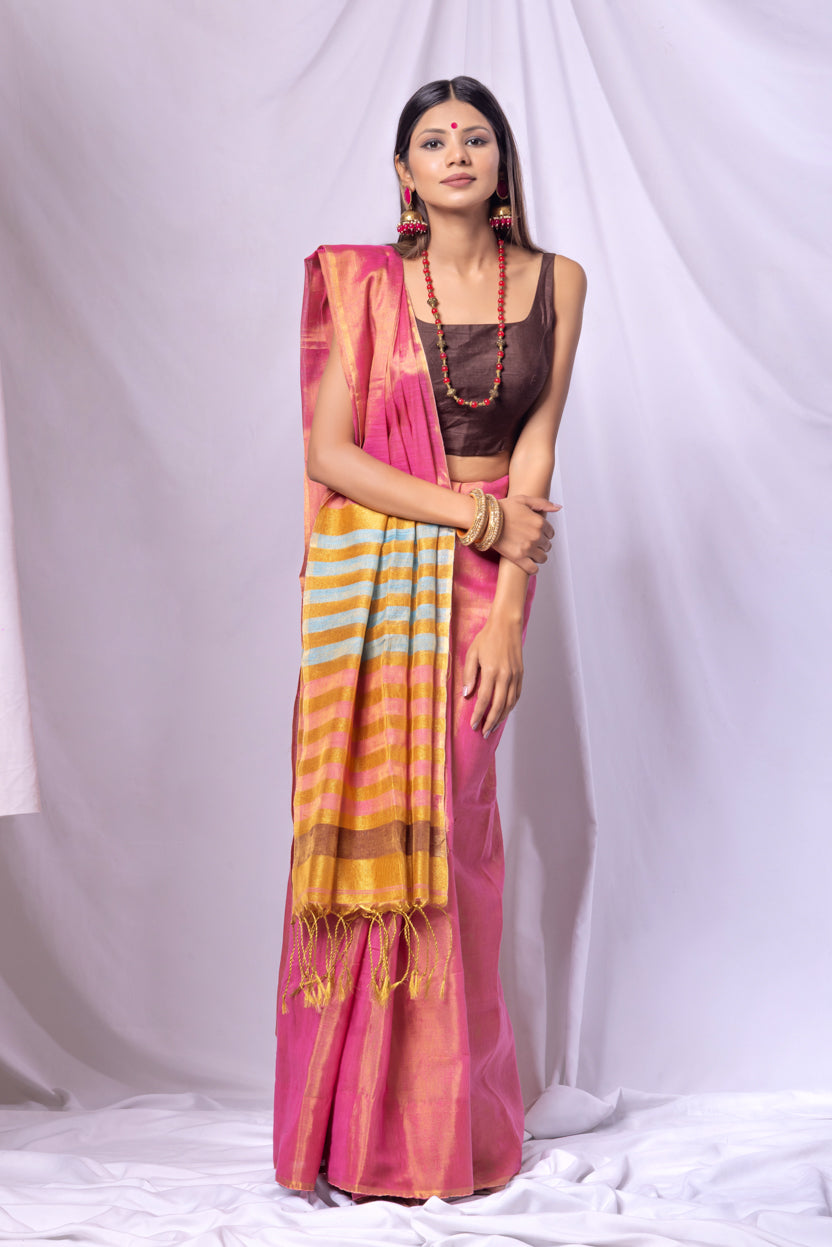 Woman wearing a colorful saree with a white background