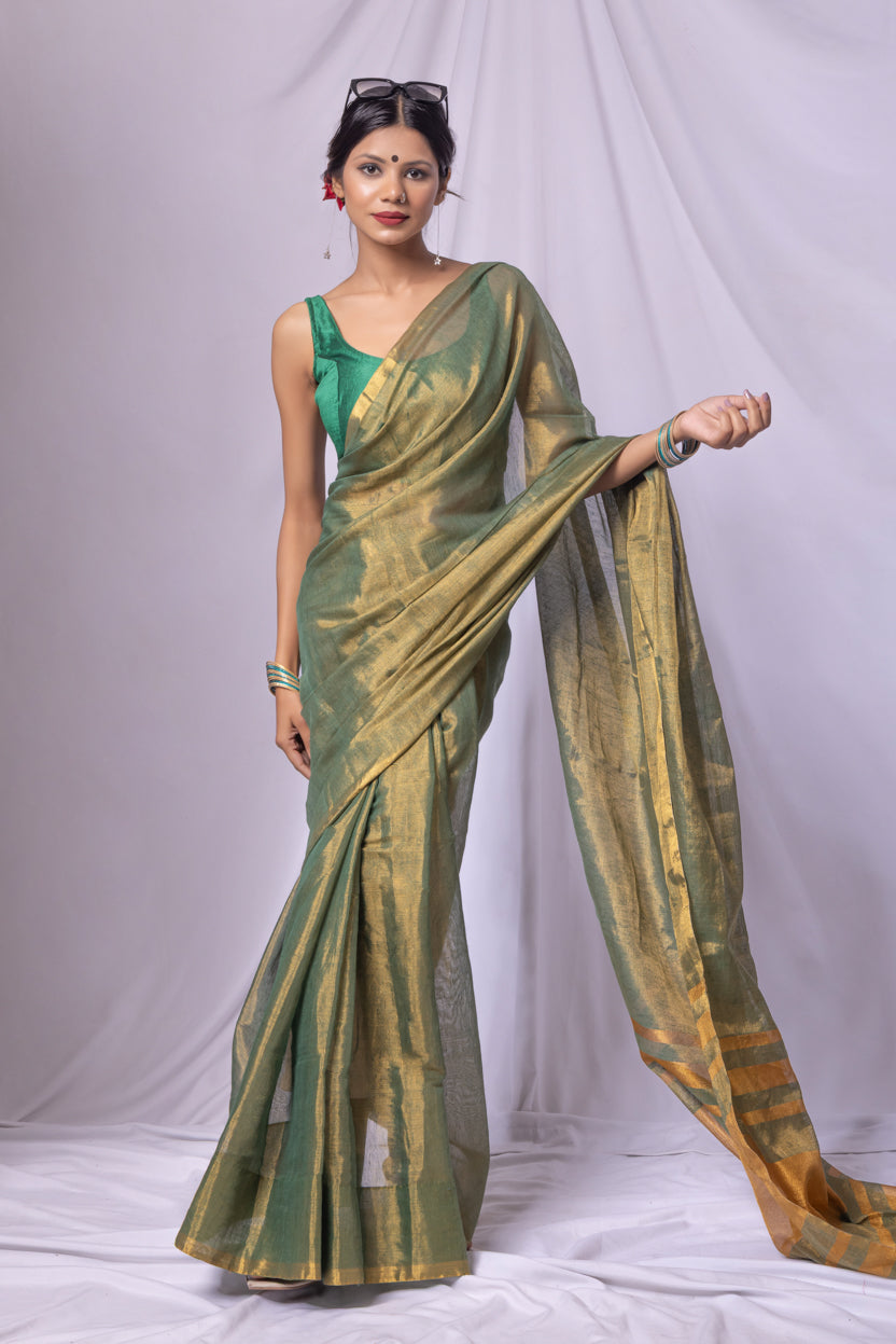 Plain linen tissue saree featuring elegant striped pallu