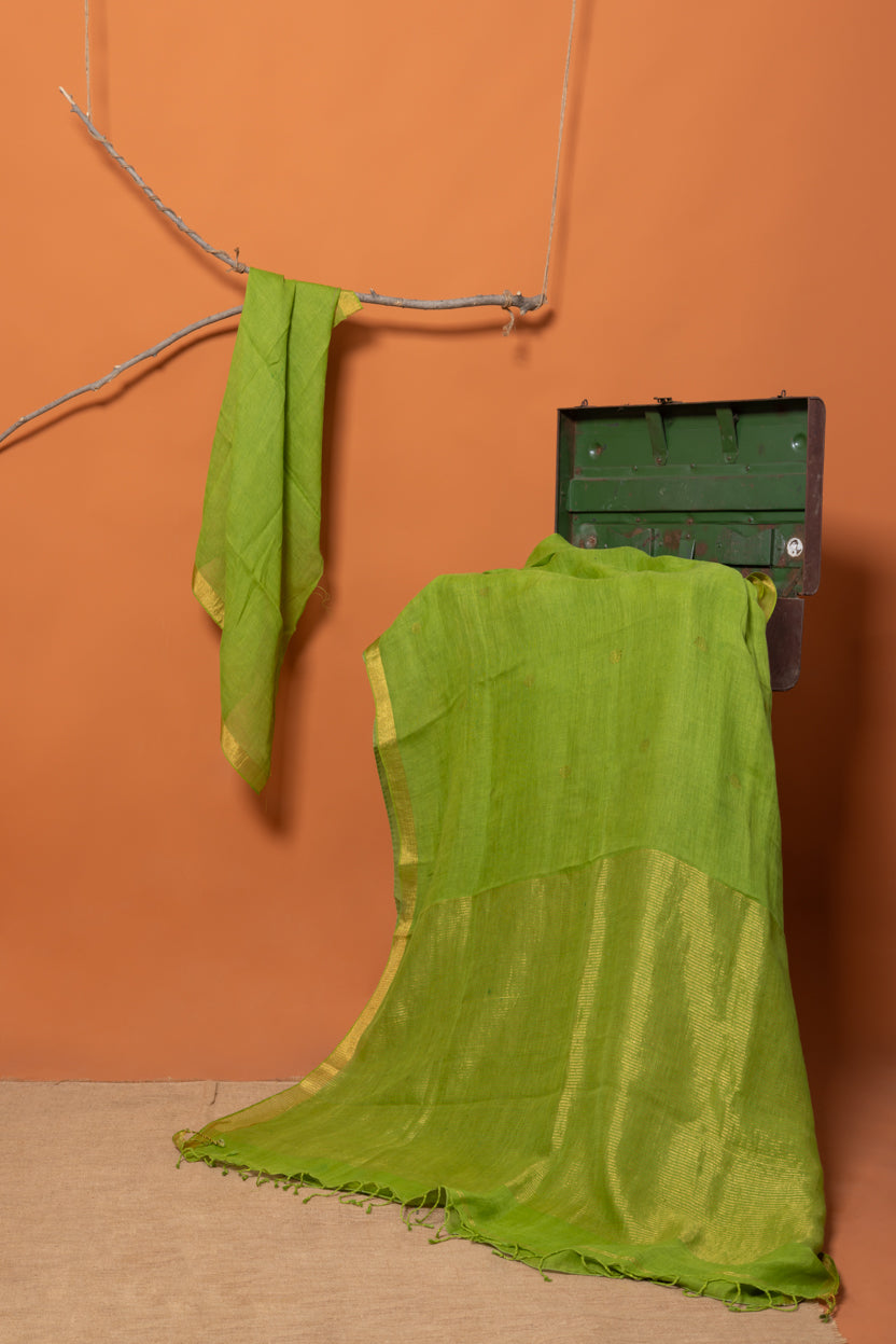 Light tender green base kissed with gold, Linen silk saree handwoven Jamdani pallu
