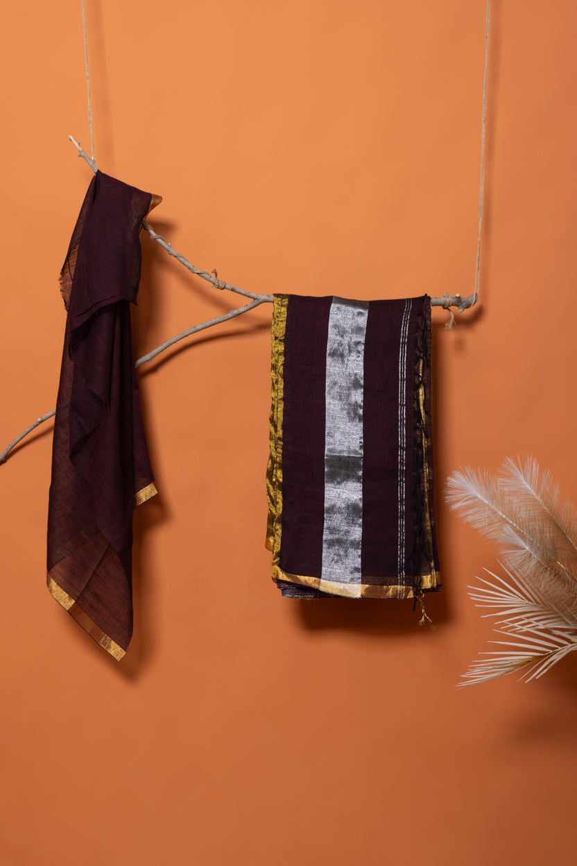 The Midnight Cola linen saree with metallic alternating bands of shimmering gold and silver zari